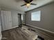 Bedroom with a ceiling fan, closet and a window needing new floor installation at 1404 S Spencer --, Mesa, AZ 85204