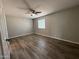 Bedroom featuring hardwood floors and a window with coverings at 1404 S Spencer --, Mesa, AZ 85204