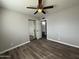 Bedroom with ceiling fan, closet and newly installed floors at 1404 S Spencer --, Mesa, AZ 85204