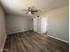This bedroom features hardwood floors and a ceiling fan at 1404 S Spencer --, Mesa, AZ 85204