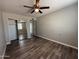 This bedroom features hardwood floors and a ceiling fan at 1404 S Spencer --, Mesa, AZ 85204
