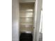 Spacious white closet with shelves and dark floors at 1404 S Spencer --, Mesa, AZ 85204