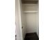 Empty white closet with no shelves and dark floors at 1404 S Spencer --, Mesa, AZ 85204