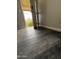View of installed wood look floors and open front door at 1404 S Spencer --, Mesa, AZ 85204