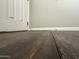 Close up view of installed floors and baseboards in a gray bedroom at 1404 S Spencer --, Mesa, AZ 85204
