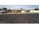 Charming single-story home with a well-maintained front yard and two-car garage at 1404 S Spencer --, Mesa, AZ 85204