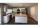 Modern kitchen with white cabinets, granite countertops, and stainless steel appliances at 1404 S Spencer --, Mesa, AZ 85204