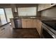 Updated kitchen featuring stainless steel appliances, granite counters, and modern cabinetry at 1404 S Spencer --, Mesa, AZ 85204