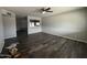 Spacious living room featuring modern wood-style flooring and neutral paint at 1404 S Spencer --, Mesa, AZ 85204