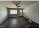 Inviting living room with wood-style flooring, a front door, and a bright window at 1404 S Spencer --, Mesa, AZ 85204