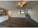 Open-concept living room adjacent to a granite kitchen, featuring modern design and natural light at 1404 S Spencer --, Mesa, AZ 85204