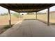 Spacious covered patio with concrete floors and large backyard at 1404 S Spencer --, Mesa, AZ 85204