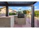Outdoor kitchen featuring a built-in grill and granite countertops at 1411 W Mendoza Ave, Mesa, AZ 85202