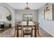 Charming dining room with a spacious table, perfect for Gathering dinners and gatherings at 1411 W Mendoza Ave, Mesa, AZ 85202