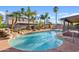 Backyard pool area surrounded by lush, mature landscaping at 1411 W Mendoza Ave, Mesa, AZ 85202