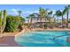 Backyard pool featuring desert landscaping and a relaxing waterfall feature at 1411 W Mendoza Ave, Mesa, AZ 85202