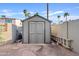 Backyard shed with grey paint and plenty of secure storage space at 1411 W Mendoza Ave, Mesa, AZ 85202