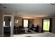 Comfortable living area with large windows, offering plenty of natural light at 1417 E Rosebud Dr, San Tan Valley, AZ 85143