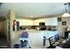 Bright kitchen with white cabinets, granite countertops, and stainless steel appliances at 1417 E Rosebud Dr, San Tan Valley, AZ 85143