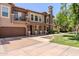 Beautiful two-story home with a balcony, well-kept yard, and attached garage at 14250 W Wigwam Blvd # 121, Litchfield Park, AZ 85340