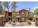 Exterior showcases a well-maintained facade with a Spanish tile roof, and multiple balconies at 14250 W Wigwam Blvd # 121, Litchfield Park, AZ 85340