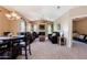 Large open concept floor plan with dining and living room combo has a ceiling fan at 14250 W Wigwam Blvd # 121, Litchfield Park, AZ 85340