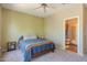 Comfortable bedroom with an adjoining bathroom and large windows for great natural light at 14250 W Wigwam Blvd # 121, Litchfield Park, AZ 85340