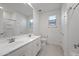 Bathroom with double sink vanity and tile flooring at 14413 W Eugene Ter, Surprise, AZ 85379
