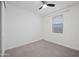 Bright bedroom with a modern ceiling fan and neutral carpeting at 14413 W Eugene Ter, Surprise, AZ 85379