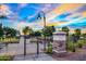 Well-maintained community entrance sign with landscaping and a stylish gate at 14413 W Eugene Ter, Surprise, AZ 85379