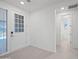 Entryway with tile floors, a view of the front door, and a hallway leading to a bathroom at 14413 W Eugene Ter, Surprise, AZ 85379