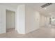 Neutral hallway featuring tile floors, light-colored walls, recessed lighting, and access to the home's entry at 14413 W Eugene Ter, Surprise, AZ 85379