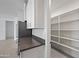 Kitchen with a view of walk-in pantry, stainless steel appliances, and ample counter space at 14413 W Eugene Ter, Surprise, AZ 85379