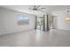 Bright, open living area with tile flooring, recessed lighting, and sliding glass doors to the backyard at 14413 W Eugene Ter, Surprise, AZ 85379