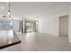 Spacious living area with island seating, large windows, and sliding glass doors at 14413 W Eugene Ter, Surprise, AZ 85379