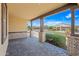 Charming covered front porch with brick pillars and beautiful views of the neighborhood street at 14413 W Eugene Ter, Surprise, AZ 85379