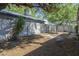 Backyard featuring large trees for shade, and wood fence providing privacy at 1450 E Topeka Dr, Phoenix, AZ 85024