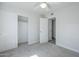 Bright bedroom with neutral carpet, ceiling fan, and closet at 1450 E Topeka Dr, Phoenix, AZ 85024