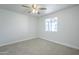 Cozy bedroom with neutral carpet and ceiling fan at 1450 E Topeka Dr, Phoenix, AZ 85024