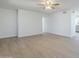 Bright living room with light wood floors and a view to the kitchen at 1450 E Topeka Dr, Phoenix, AZ 85024