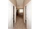 A stylish bathroom with dual closets, decorative tile floors, a soaking tub, and a window made of glass blocks at 14833 S 14Th Pl, Phoenix, AZ 85048