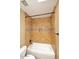 Close up on bathroom tub featuring stone tile surround and shower niche at 14833 S 14Th Pl, Phoenix, AZ 85048