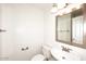 Powder bathroom with toilet, sink, and mirror at 14833 S 14Th Pl, Phoenix, AZ 85048