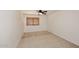 Cozy bedroom showcasing neutral carpet, a ceiling fan, and window with wood blinds at 14833 S 14Th Pl, Phoenix, AZ 85048