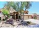 Beautiful home featuring stone accents, a desert landscape, and a stone walkway at 14833 S 14Th Pl, Phoenix, AZ 85048