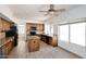 Bright kitchen featuring granite countertops, an island, and plenty of cabinet space at 14833 S 14Th Pl, Phoenix, AZ 85048