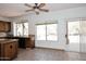 Bright kitchen with granite countertops, wooden cabinets, and a view to the backyard at 14833 S 14Th Pl, Phoenix, AZ 85048