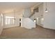 An open-concept living room with a high vaulted ceiling, tile floors, and carpet flooring at 14833 S 14Th Pl, Phoenix, AZ 85048