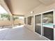 A cozy outdoor patio with covered seating area, views of the pool, and access to the backyard at 14833 S 14Th Pl, Phoenix, AZ 85048