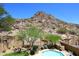 Inviting pool area with mountain views, well-manicured landscaping, and an inground swimming pool, perfect for relaxation at 14833 S 14Th Pl, Phoenix, AZ 85048